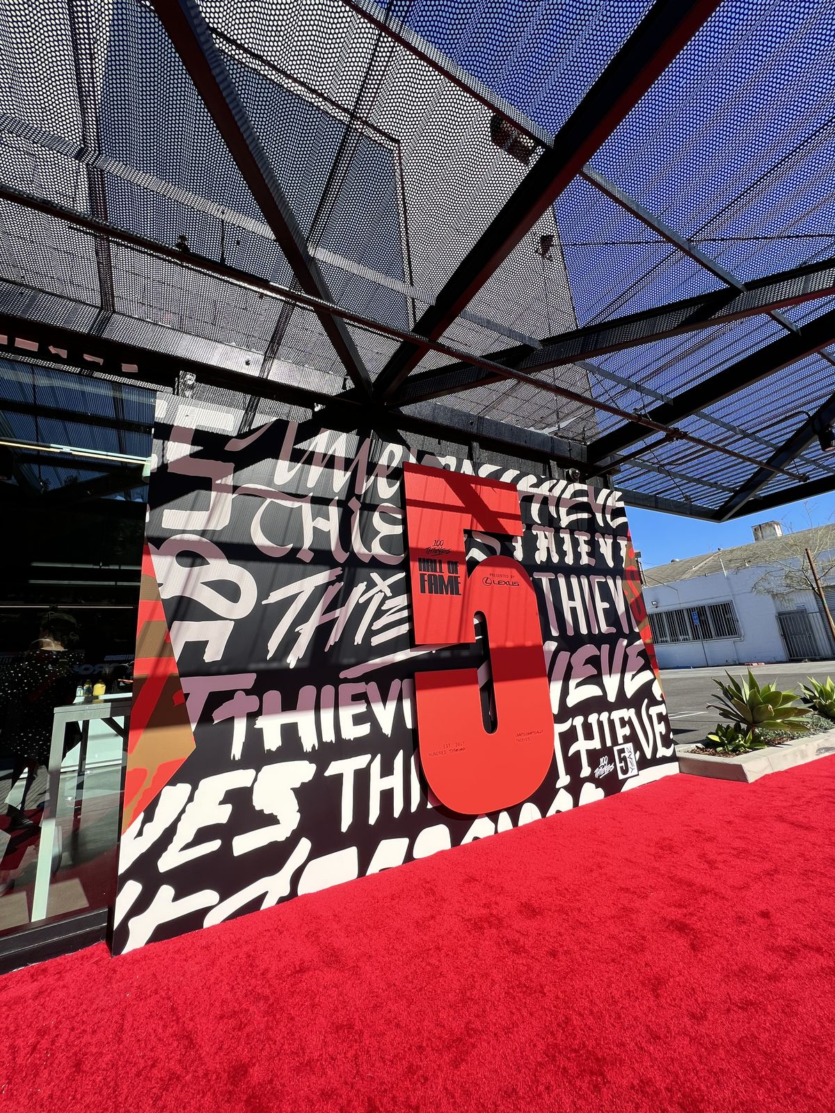 Oversized graphic hall of fame wall on a red carpet